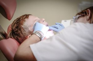 Dentist working on a child's teeth